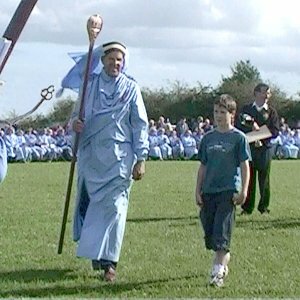 a young competition winner goes up to receive his prize at the 2002 Open Gorseth in Pensilva